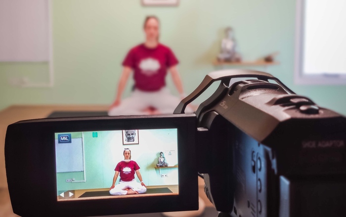 Certified yoga instructor records a yoga tutorial Certified yoga instructor records a yoga tutorial