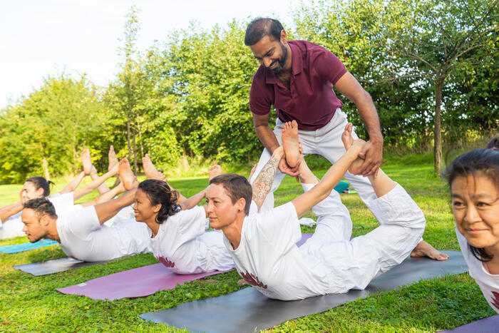 Yoga practitioner practice yoga poses outside on a yoga retreat Yoga practitioner practice yoga poses outside on a yoga retreat