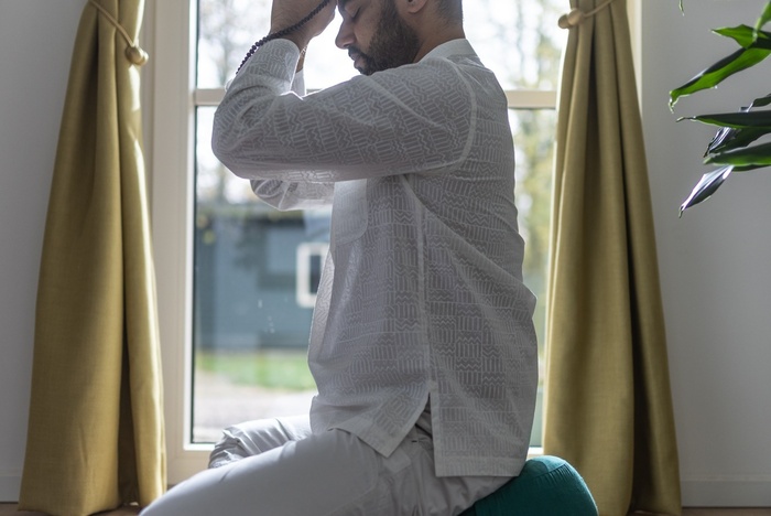 A yoga practitioner creates a yoga space at home