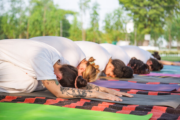 Group of yoga practitioners relax in Child’s Pose Group of yoga practitioners relax in Child’s Pose