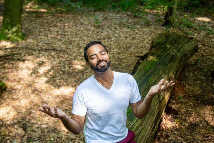 A yoga practitioner relaxes in nature