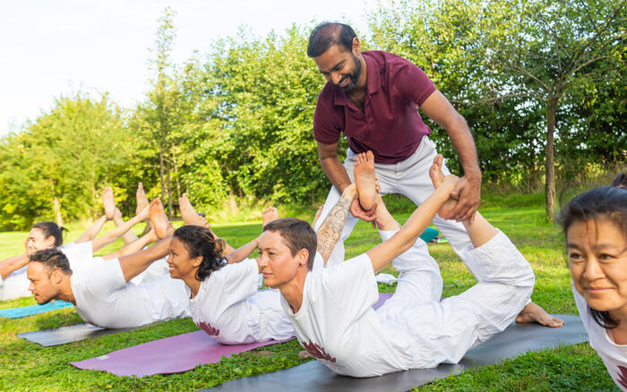 Students learning yoga to maintain proper posture Students learning yoga to maintain proper posture