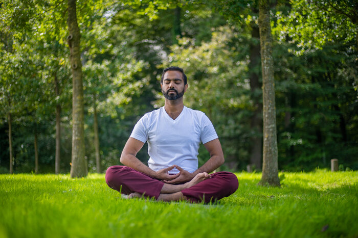 Yoga practitioner finds inner piece during meditation Yoga practitioner finds inner piece during meditation