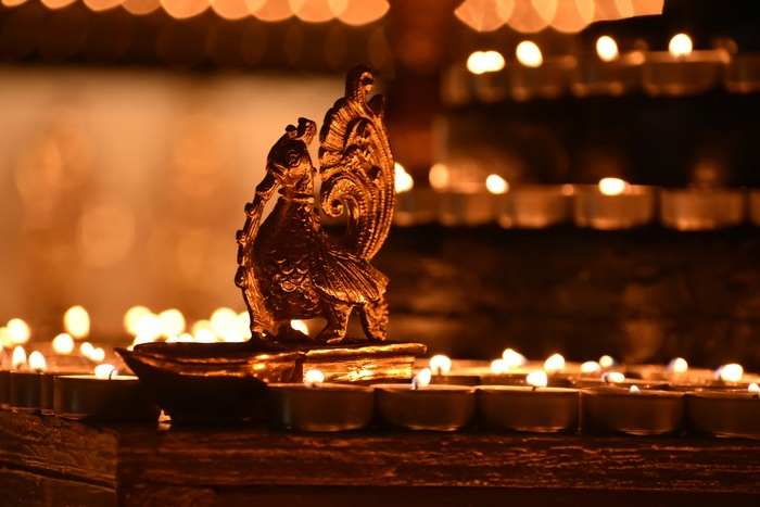 Diyas lit around idol in Diwali