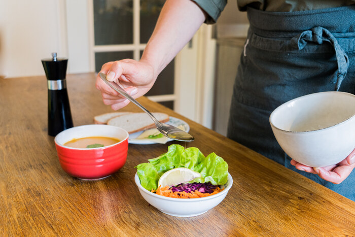 Yogi prepares a meal according to Mitahara, mindful yogic eating Yogi prepares a meal according to Mitahara, mindful yogic eating