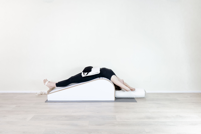 Fish pose practices with props