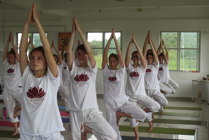 Students practicing yoga pose Students practicing yoga pose