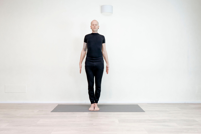 Practicing Mountain pose, best known as Tadasana