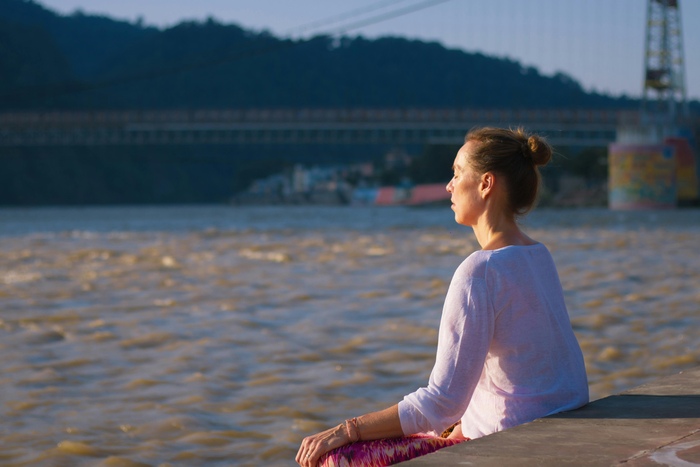 Meditation session on the banks of the River Ganges in Rishikesh Meditation session on the banks of the River Ganges in Rishikesh
