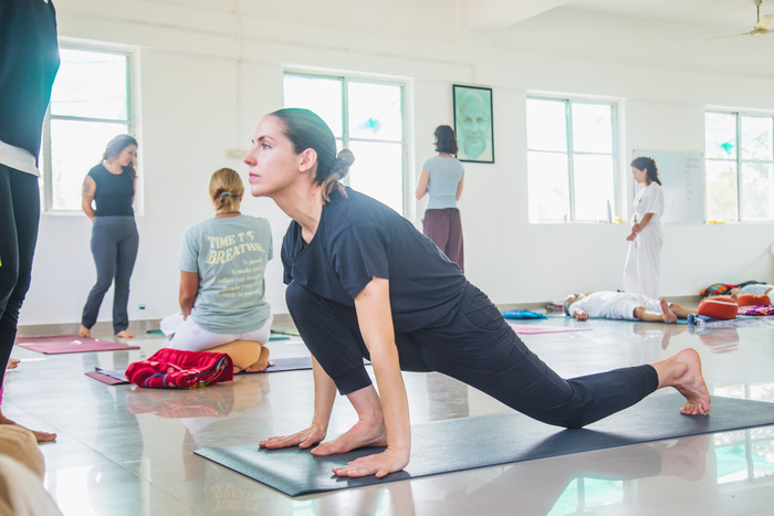 Hanumanasana practice at yoga ashram Yoga student learning beginner Hanumanasana at yoga ashram