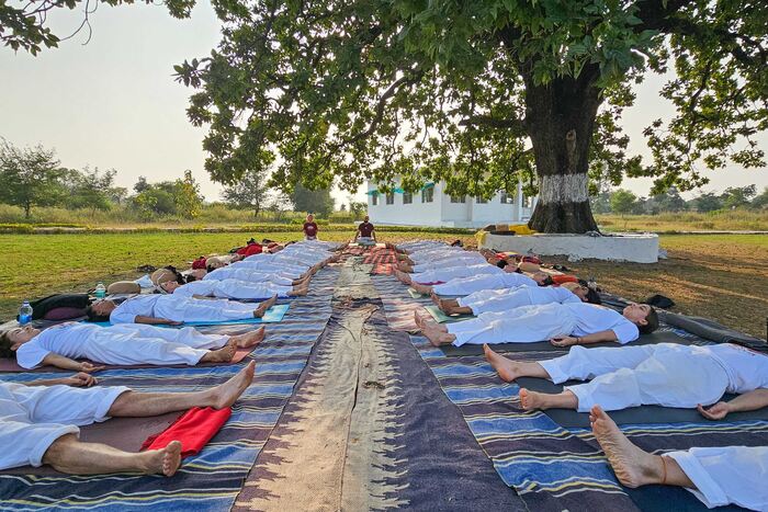 Students relaxing in Shavasana during 200-Hour YTT YTT students lying in Shavasana, a glimpse from 200-Hour YTT